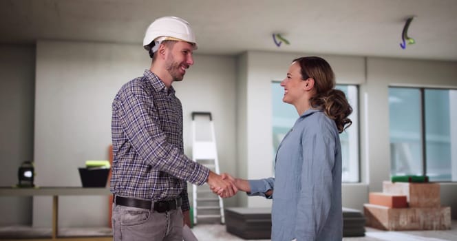 Home Renovation Contractor And Happy Woman Handshake