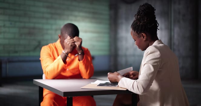 Criminal Defense Attorney In Prison. Police Investigator In Interrogation Room
