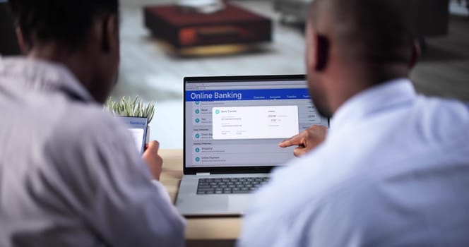 African American Using Online Bank Account On Mobile Phone