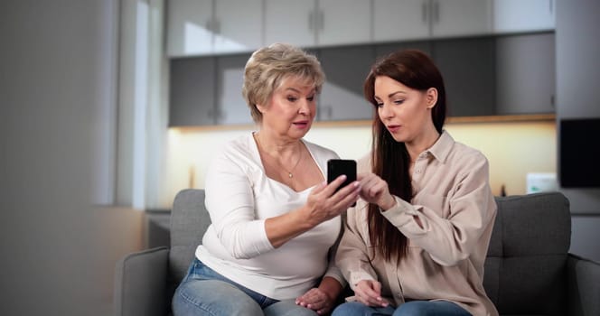Teaching Tablet To Senior Woman. Assisting Mum