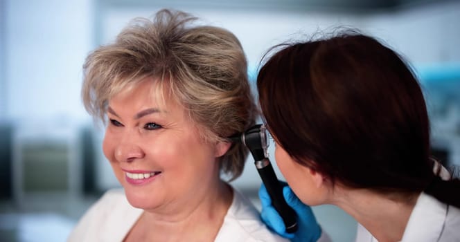 Otolaryngology Ear Check Using Otoscope. Doctor Examining Patient