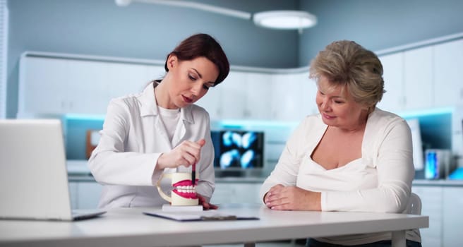 Older Patient Visiting Dental Implant Center For Treatment Consultation