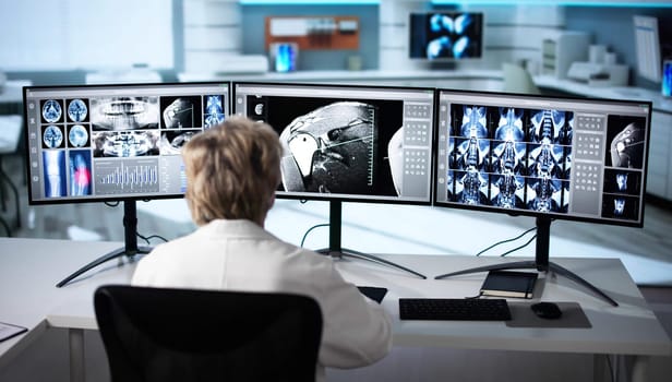 Radiologist Dentist Using X Ray Software On Desktop Computer