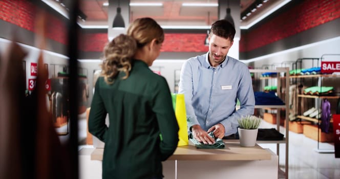 Cashier Retail Assistant At Cloth Store Counter