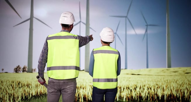 Wind Turbine Engineers At Sustainable Green Energy Farm