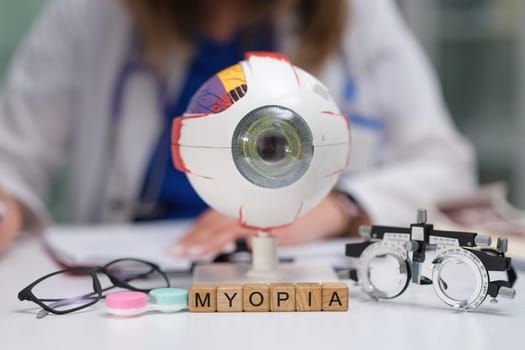 This informative visual effectively illustrates myopia by utilizing an eye model alongside various optical instruments