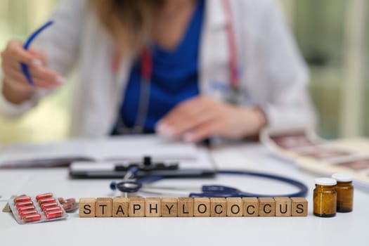 A healthcare environment showcasing a dedicated medical professional analyzing Staphylococcus in depth
