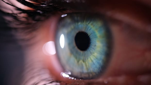 A macro shot showcasing the intricate details and vivid colors of a mesmerizing blue eye with a vibrant iris