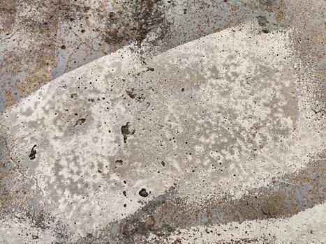 Weathered concrete exhibits a variety of textures and patterns, showcasing natural wear, color variations, and potential artistic use.