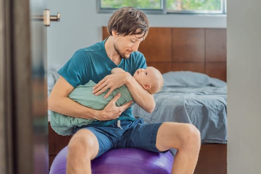 A father sits on a fitness ball in a cozy bedroom, gently rocking his baby wrapped in a soft muslin swaddle. A nurturing and soothing moment of fatherhood and care. Parenting, bonding, and comfort concept.