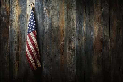 A vintage American flag hangs against a rustic wooden background, showcasing rich textures and colors that evoke a sense of patriotism and heritage.