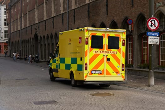 Bruges, Belgium – May 13, 2024: Ambulance in the city center of Bruges in Belgium