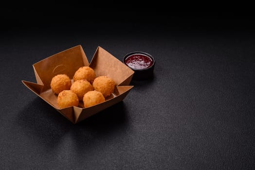 Crispy French fries with camembert or mozzarella cheese with cranberry or raspberry sauce
