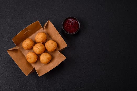 Crispy French fries with camembert or mozzarella cheese with cranberry or raspberry sauce