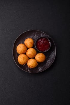 Crispy French fries with camembert or mozzarella cheese with cranberry or raspberry sauce
