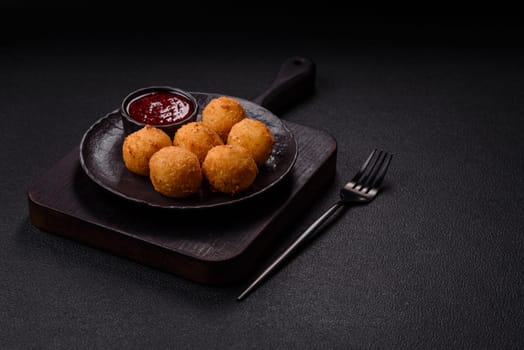 Crispy French fries with camembert or mozzarella cheese with cranberry or raspberry sauce