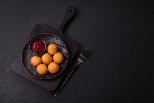Crispy French fries with camembert or mozzarella cheese with cranberry or raspberry sauce
