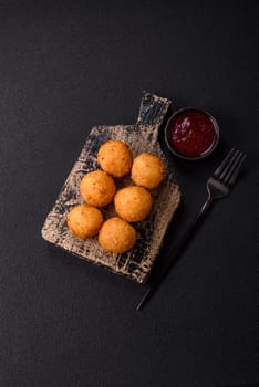 Crispy French fries with camembert or mozzarella cheese with cranberry or raspberry sauce