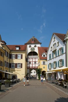 Meersburg, Germany – August 03, 2024: Old town, lower town of Meersburg on Lake Constance with the Unterstadttor, lower town gate and some tourists