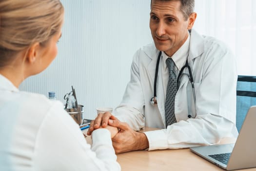 Doctor in professional uniform examining patient at hospital or medical clinic. Health care , medical and doctor staff service concept. Jivy