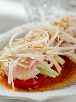 Sophisticated Fish ceviche in modern restaurant interior. Ceviche or Cebiche is a fish dish of the cuisine of Peru