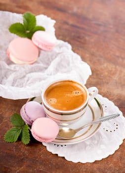 Macaroon with raspberries cookies on a wooden background