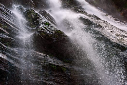 Water from the waterfall splashing through the rocks in Minas Gerais state, Brazil