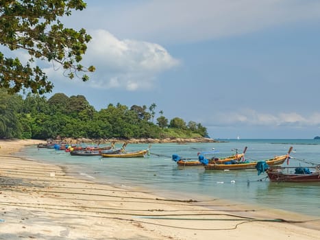 Fishing boats at the beach in Phuket by day, Thailand