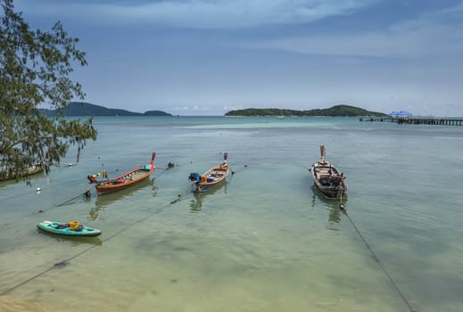 Fishing boats at the beach in Phuket by day, Thailand