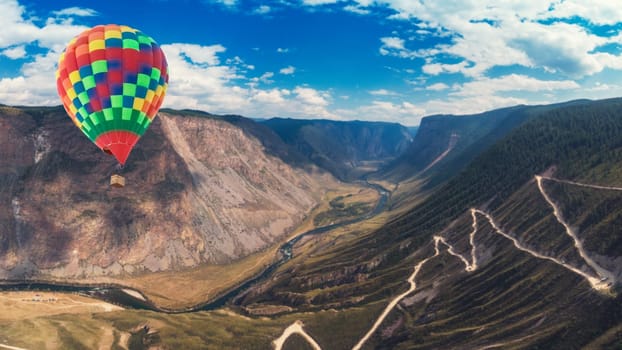Hot air balloon above of the Katu Yaryk mountain pass and the valley of the river of Chulyshman. Altai Republic, Russia, beautiful summer day