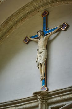 Crucifixion scene of Jesus Christ on the facade of a church in Bruges, Belgium