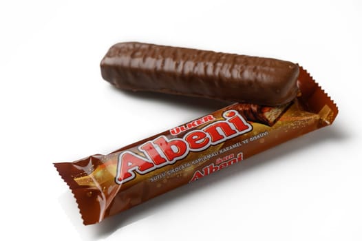 Gaziveren Cyprus -22.01.2025 A delicious chocolate bar and a single treat lay side by side, promising a moment of sweet satisfaction and joy.