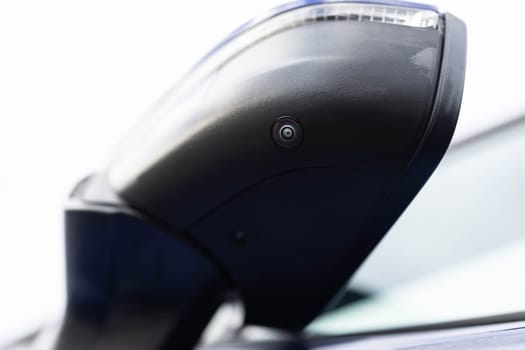Surround view camera system in modern car. Camera lens underneath side mirror blind spot camera system. Parking assist systems. Surround View 360 Degrees Reverse Camera Front camera.