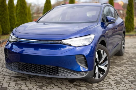 Modern subcompact electric crossover car SUV. Exterior details. Large size wheels. Exterior of fully electric suv car. Car for sale and rent business concept. Electric automobile.