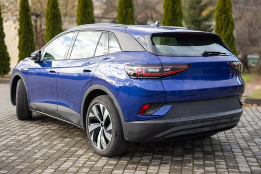 Modern electric crossover car SUV. Exterior details. Exterior of electric suv car. Rear view car parked. Car for sale and rent business concept. Automobile leasing and insurance concept.