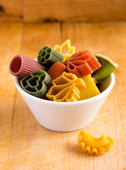 Multicolored italian pasta in bowl