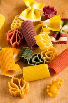 Multicolored italian pasta, vertical background