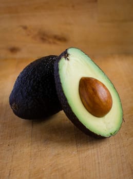 A fresh avocado cut in half