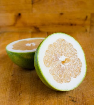 White grapefruit on wooden background