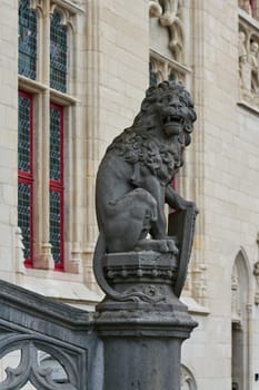 a lion, the heraldic animal of Flanders, in front of the Provincial Palace, Provinciaal Hof in the old town of Bruges in Belgium
