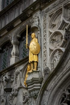 Gilded depiction of Dietrich of Alsace, Diederik van de Elzas on the facade of the St. Ivo Chapel on Burg Square, de Burg in Bruges, Belgium