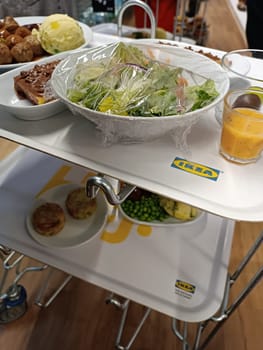 January 20, 2025 - Gdansk, Poland: tray with ikea food meal lunch meatballs puree salad dessert pea juice . High quality photo