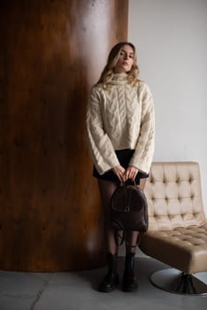 photo of a brown leather backpack with retro look. indoors photo