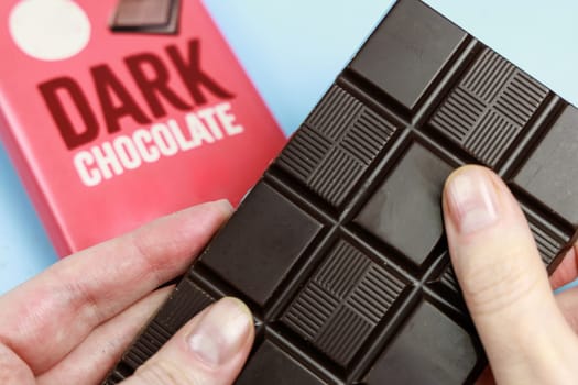 Delicious dark chocolate bar with the inscription Dark Chocolate. Healthy eating concept. High quality photo