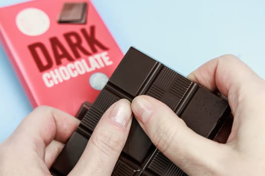 Delicious dark chocolate bar with the inscription Dark Chocolate. Healthy eating concept. High quality photo