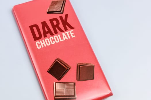 Delicious dark chocolate bar with the inscription Dark Chocolate. Healthy eating concept. High quality photo