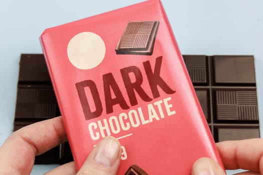 Delicious dark chocolate bar with the inscription Dark Chocolate. Healthy eating concept. High quality photo
