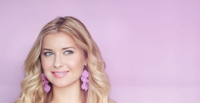 Blonde woman with soft curls and radiant purple earrings, set against a gentle lilac background. Her serene expression and soft smile evoke elegance and grace look