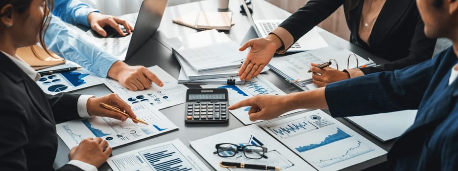 Auditor and accountant team working in office, analyze financial data and accounting record with calculator. Accounting company provide finance and taxation planning for profitable cash flow. Insight