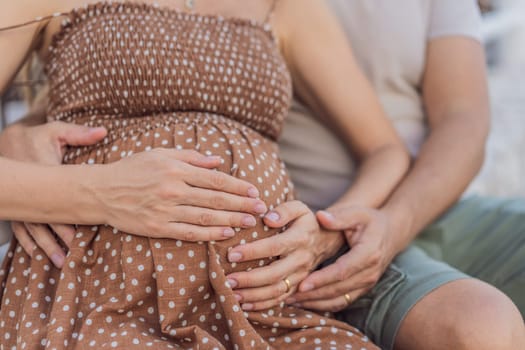 A happy, mature couple over 40, enjoying a leisurely walk in a park, their joy evident as they embrace the journey of pregnancy later in life.